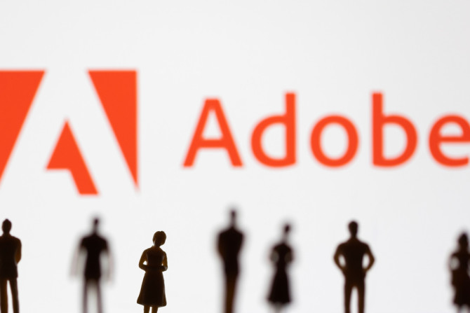 A ilustração mostra estatuetas na frente do logotipo da Adobe